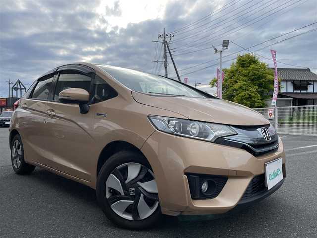 ホンダ フィット ハイブリット Lパッケージ 埼玉県 2014(平26)年 6.9万km ライトベージュM 16号上尾南店代車落札予定になります落札不可になります/ワンオーナー/純正ナビ/（フルセグTV/FM/AM/CD/USB/IPOD/BT/HDMI)/クルーズコントロール/バックカメラ/ETC/ステアリングリモコン/純正15インチAW/スマートスペアキー×1/プッシュスタート/純正ドアバイザー/純正フロアマット/ドアミラーウィンカー/パワーウィンドウ/集中ドアロック/車両/ナビ取扱説明書