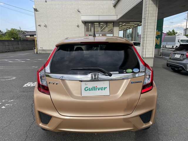ホンダ フィット ハイブリット Lパッケージ 埼玉県 2014(平26)年 6.9万km ライトベージュM 16号上尾南店代車落札予定になります落札不可になります/ワンオーナー/純正ナビ/（フルセグTV/FM/AM/CD/USB/IPOD/BT/HDMI)/クルーズコントロール/バックカメラ/ETC/ステアリングリモコン/純正15インチAW/スマートスペアキー×1/プッシュスタート/純正ドアバイザー/純正フロアマット/ドアミラーウィンカー/パワーウィンドウ/集中ドアロック/車両/ナビ取扱説明書