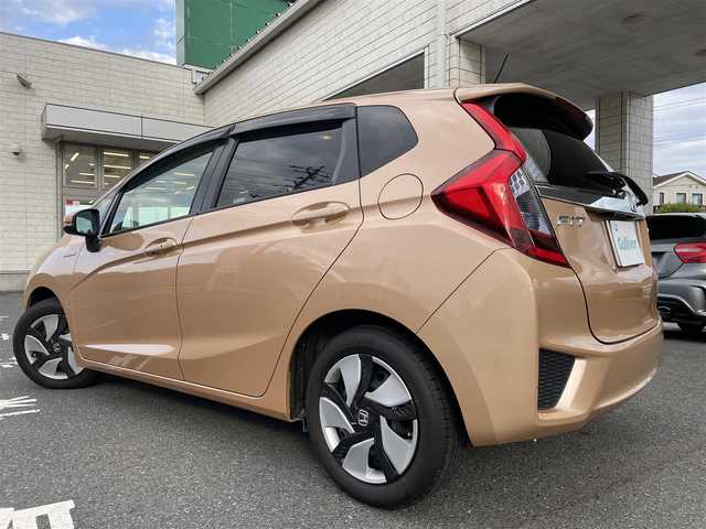 ホンダ フィット ハイブリット Lパッケージ 埼玉県 2014(平26)年 6.9万km ライトベージュM 16号上尾南店代車落札予定になります落札不可になります/ワンオーナー/純正ナビ/（フルセグTV/FM/AM/CD/USB/IPOD/BT/HDMI)/クルーズコントロール/バックカメラ/ETC/ステアリングリモコン/純正15インチAW/スマートスペアキー×1/プッシュスタート/純正ドアバイザー/純正フロアマット/ドアミラーウィンカー/パワーウィンドウ/集中ドアロック/車両/ナビ取扱説明書