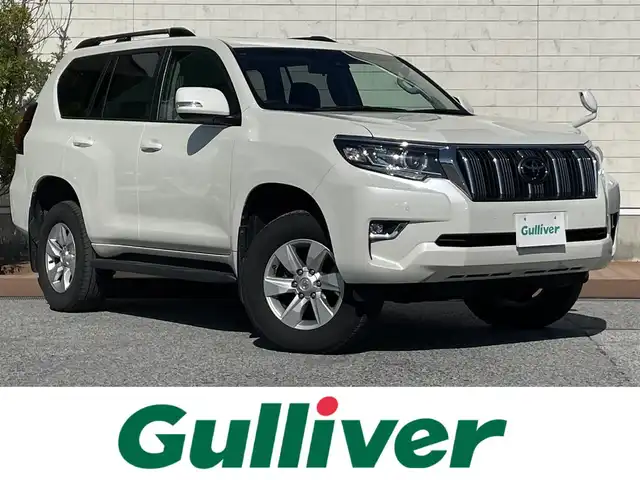 トヨタ ランドクルーザー プラド TX 滋賀県 2021(令3)年 6.2万km ホワイトパールクリスタルシャイン サンルーフ/純正7インチナビ【NSCN-W68】/（AM/FM/CD/フルセグ/Bluetooth/SD/AUX）/バックカメラ/ETC/トヨタセーフティセンス/・ブレーキアシスト/・プリクラッシュブレーキアシスト/・ヒルスタート（坂道発進）アシスト/・前方衝突防止支援システム/・TCS（トラクションコントロールシステム）/・VDC（ビークルダイナミクスコントロール）/・レーンキープアシスト/・車間自動制御システム/・ASCD（オートスピードコントロール装置）/・ABS（アンチロックブレーキシステム）/・バックビューモニター/・コーナー・バックセンサー（ソナー）/・標識検知機能/・盗難防止アラーム	/電動格納ミラー/ステアリングスイッチ/オートライト/LEDヘッドライト/フロントフォグ/フルオートエアコン/プッシュスタート/スマートキー/純正フロアマット