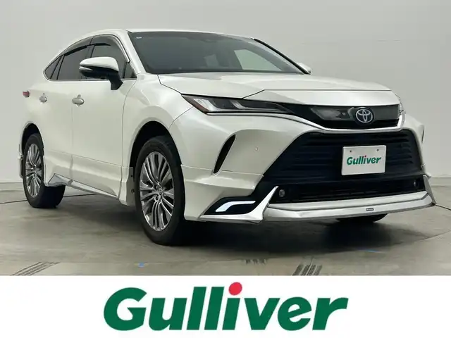 トヨタ ハリアー ハイブリッド Z 岡山県 2021(令3)年 3.4万km ホワイトパールクリスタルシャイン モデリスタエアロ/ＪＢＬサウンド/純正１２．３インチナビ/【Bluetooth/フルセグTV/Carplay】/デジタルインナーミラー/レーダークルーズコントロール/衝突軽減ブレーキシステム/運転席パワーシート/ハーフレザーシート　/ブラインドスポットモニター/ヘッドアップディスプレイ/ビルトインETC2.0/LEDヘッドライト/純正フロアマット/ドアバイザー/新車保証書/取扱説明書/スペアキー×１