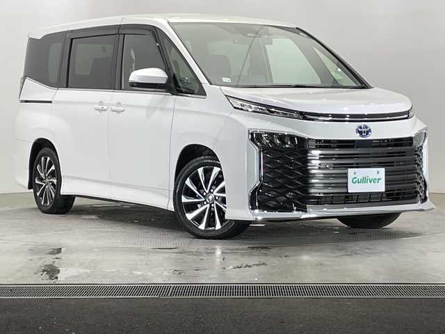 トヨタ ヴォクシー ハイブリッド S－Z 栃木県 2022(令4)年 2.2万km ホワイトパールクリスタルシャイン 純正10.5インチメモリナビ/（CD/DVD/フルセグTV/Bluetooth/USB/HDMI/Miracast）/バックカメラ/トヨタセーフティセンス/コーナーセンサー/ETC2.0/前後ドライブレコーダー/両側パワースライドドア/ハーフレザーシート/前席シートヒーター/禁煙車/オートライト/LEDヘッドライト/横滑り防止装置/AC100V電源/フォグランプ/スマートキー/プッシュスタート/ステアリングスイッチ/革巻きステアリング/ウィンカーミラー/純正17インチアルミホイール/純正フロアマット