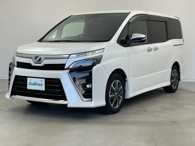 トヨタ ヴォクシー ZS 煌Ⅱ 新潟県 2020(令2)年 5万km ホワイトパールクリスタルシャイン 純正9インチSDナビ/フルセグTV/バックカメラ/フリップダウンモニター/純正サイドスポイラー/ビルトインETC/両側パワースライドドア/クルーズコントロール/レーンキープアシスト/コーナーセンサー/MTモード付AT/純正１６インチアルミホイール/LEDヘッドライト/フォグランプ/オートライト/オートハイビーム/衝突被害軽減ブレーキ/純正フロアマット/リアロールサンシェード/プッシュスタート/スマートキー