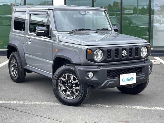スズキ ジムニー シエラ JC 道東・釧路十勝 2022(令4)年 0.8万km ミディアムグレー ・ワンオーナー/・４WD/・社外SDメモリナビ/（CD・DVD・AM・FM・BT・SD・フルセグ）/・デュアルセンサーブレーキサポート/・スマートキー/・プッシュスタート/・オートライト/・クルーズコントロール/・ヒルスタートアシスト/・横滑り防止装置/・電動格納ミラー/・背面タイヤ/・純正アルミホイール/・デフロック/・ETC/・保証書/・取説書