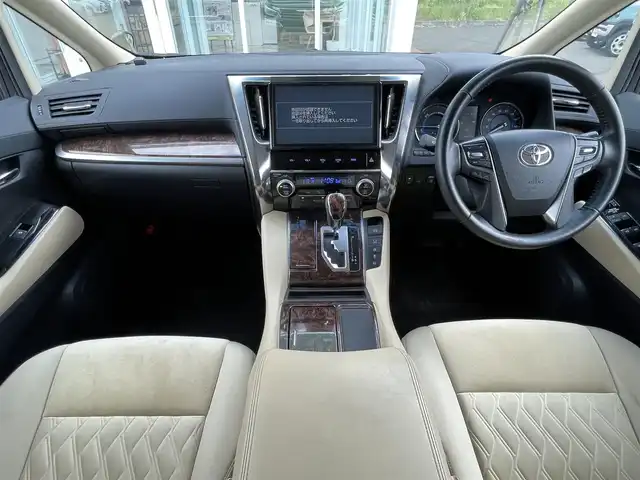 トヨタ ヴェルファイア ハイブリット X 道央・札幌 2018(平30)年 6.6万km ブラック ・４WD/・衝突軽減ブレーキ/・寒冷地仕様/・両側パワースライドドア/・サンルーフ/・純正ナビ/　CD＆DVD＆BT＆TV/・バックカメラ/・フリップダウンモニター/・コーナーセンサー/・レーンキープアシスト/・レーダークルーズコントロール/・AC１００V /・ワイパー熱線/・オートエアコン/・オートライト/・オートリトラミラー/・ステアリングスイッチ/・ハンズフリー/・プッシュスタート/・スマートキー/・リアヒッチメンバー/・ビルトインETC/・LEDヘッドライト/・MT付きAT/・純正フロアマット/・ドアバイザー/・ウィンカーミラー/・フォグライト/・スペアキー