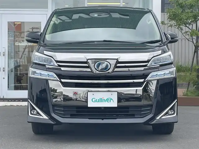 トヨタ ヴェルファイア ハイブリット X 道央・札幌 2018(平30)年 6.6万km ブラック ・４WD/・衝突軽減ブレーキ/・寒冷地仕様/・両側パワースライドドア/・サンルーフ/・純正ナビ/　CD＆DVD＆BT＆TV/・バックカメラ/・フリップダウンモニター/・コーナーセンサー/・レーンキープアシスト/・レーダークルーズコントロール/・AC１００V /・ワイパー熱線/・オートエアコン/・オートライト/・オートリトラミラー/・ステアリングスイッチ/・ハンズフリー/・プッシュスタート/・スマートキー/・リアヒッチメンバー/・ビルトインETC/・LEDヘッドライト/・MT付きAT/・純正フロアマット/・ドアバイザー/・ウィンカーミラー/・フォグライト/・スペアキー