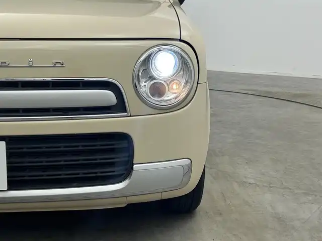 スズキ ラパン X 岡山県 2013(平25)年 7.4万km ミルクティーベージュメタリック メモリーナビ/【Bluetooth/フルセグTV/CD/DVD】/型番:CN-RE05D/スマートキー/プッシュスタート/ビルトインＥＴＣ/キセノンヘッドライト/オートライト/アイドリングストップ/ショコラ専用シート/純正フロアマット/禁煙車/横滑り防止装置/ドアバイザー/取扱説明書/ナビ取扱説明書