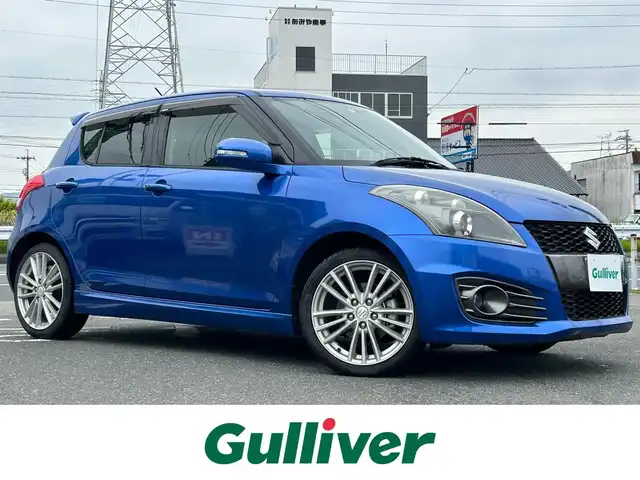 スズキ スイフト スポーツ 愛知県 2013(平25)年 4.9万km ブーストブルーパールメタリック 社外メモリナビ/フルセグテレビ/バックカメラ/アイドリングストップ/ウィンカーミラー/ドアバイザー/プッシュスタート/ETC/クルーズコントロール/Bluetooth/レザーステアリング/AUTOライト/フォグライト/ドラレコ