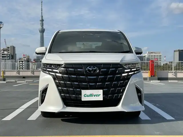 トヨタ アルファード Z 東京都 2024(令6)年 0.6万km プラチナホワイトパールマイカ ワンオーナー/Toyota Safety Sense/・プリクラッシュセーフティ（歩行者［昼夜］・自転車運転者［昼］・自動二輪車［昼］検知機能付衝突回避支援タイプ/ミリ波レーダー＋単眼カメラ方式)/・レーントレーシングアシスト［LTA］+レーンディパーチャーアラート［LDA］/・レーダークルーズコントロール(全車速追従機能付)/・アダプティブハイビームシステム［AHS］/・ロードサインアシスト［RSA］/・ドライバー異常時対応システム/・プロアクティブドライビングアシスト［PDA］/・発信遅れ告知機能/・ブラインドスポットモニター［BSM］+安心降車アシスト(ドアオープン制御付)［SEA］+後方車両接近告知+周辺車両接近時サポート(通報提案機能)+後方車両への接近警報+セカンダリーコリジョンブレーキ(停車中後突対応)/パーキングブレーキサポート/パノラミックビューモニター/14インチHDディスプレイナビゲーションシステム/・地デジ(12セグ/ワンセグ)/・Bluetooth/・Apple CarPlay/Android Auto/・USB/快適温熱シート+ベンチレーションシート/保証書・取説・スペアキー１本