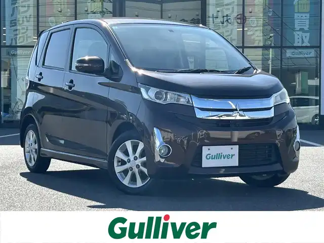 三菱 ｅＫカスタム G 岡山県 2015(平27)年 6.6万km ショコラブラウンP 登録時走行距離65634km/社外ナビ/（AM/FM/CD/DVD/BT）/全方位カメラ/アイドリングストップ/電格ミラー/オートエアコン/プッシュスタート/スマートキー/純正14インチアルミホイール