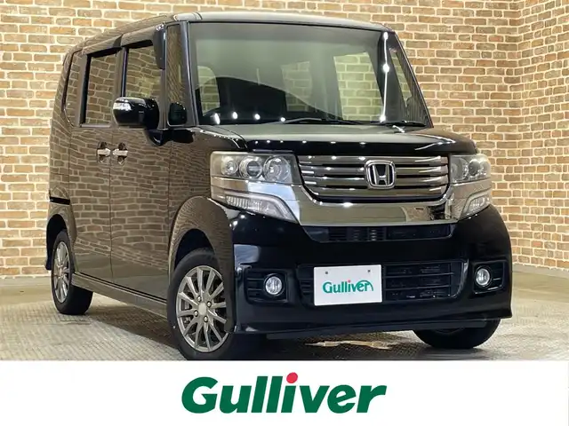 ホンダ Ｎ ＢＯＸ カスタム G Lパッケージ 岩手県 2012(平24)年 10.5万km クリスタルブラックパール ４WD/左側パワースライドドア/両側イージークローザードア/横滑り防止装置/アイドリングストップ/ヒルスタートアシスト/フルオートエアコン/ヒーテッドドアミラー/チップアップリヤシート/純正ナビ/（CD/DVD/フルセグ/SD/HDD）/ステアリングスイッチ/バックカメラ/ETC/オートライト/HIDヘッドライト/フォグライト/社外14インチアルミホイール