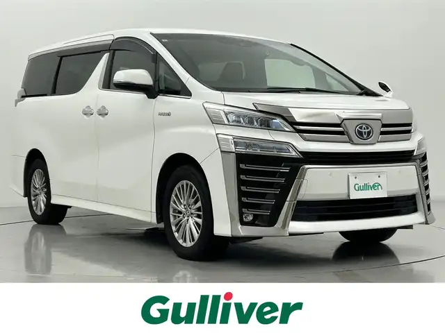 トヨタ ヴェルファイア ハイブリット ZR 熊本県 2021(令3)年 7.2万km ホワイトパールクリスタルシャイン ワンオーナー/純正ナビ（走行中視聴可能）/CD/DVDデッキ/純正フリップダウンモニター/ビルトインETC/レザーシート/前席シートヒーター/シートベンチレーション/パワーバックドア/社外前後ドライブレコーダー/トヨタセーフティセンス/・プリクラッシュセーフティ/・レーントレーシングアシスト/・レーダークルーズコントロール/・オートマチックハイビーム/・ロードサインアシスト/・パーキングサポートブレーキ/純正１７インチアルミホイール/保証書/取扱説明書