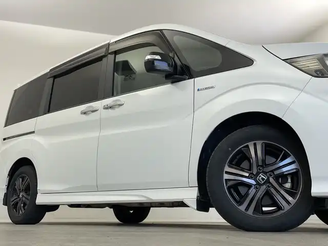 ホンダ ステップワゴン スパーダ ハイブリッドG EX HセンシングBスタイ 新潟県 2019(令1)年 5.6万km プラチナホワイトパール ワンオーナー/純正メモリナビ/　フルセグTV/Bluetooth/CD/DVD/ホンダセンシング/・衝突被害軽減ブレーキ/・誤発進抑制機能/・歩行者事故低減ステアリング/・路外逸脱抑制機能/・アダプティブクルーズコントロール/・車線維持支援システム/・先行車発進お知らせ機能/・標識認識機能/ハーフレザーシート/前席シートヒーター/両側パワースライドドア/純正ドライブレコーダー/バックモニター/ビルトインETC/レザーステアリング/ステアリングスイッチ/禁煙車