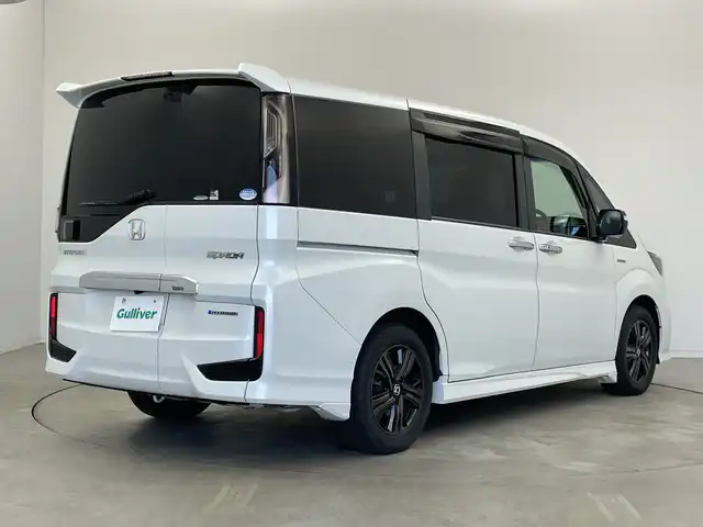 ホンダ ステップワゴン スパーダ ハイブリッドG EX HセンシングBスタイ 新潟県 2019(令1)年 5.6万km プラチナホワイトパール ワンオーナー/純正メモリナビ/　フルセグTV/Bluetooth/CD/DVD/ホンダセンシング/・衝突被害軽減ブレーキ/・誤発進抑制機能/・歩行者事故低減ステアリング/・路外逸脱抑制機能/・アダプティブクルーズコントロール/・車線維持支援システム/・先行車発進お知らせ機能/・標識認識機能/ハーフレザーシート/前席シートヒーター/両側パワースライドドア/純正ドライブレコーダー/バックモニター/ビルトインETC/レザーステアリング/ステアリングスイッチ/禁煙車