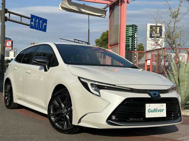 トヨタ カローラツーリング ハイブリッド ダブルバイビー 香川県 2023(令5)年 3.1万km プラチナホワイトパールマイカ 純正SDナビ/【Bluetooth/フルセグ】/ヘッドアップディスプレイ/ハンドルヒーター/電子パーキング/バックカメラ/ハーフレザーシート/純正17インチアルミ/スマートキー/LEDヘッドライト/純正ETC/純正フロアマット/パワーステアリング/パワーウィンドウ