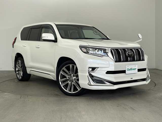 トヨタ ランドクルーザー プラド TX Lパッケージ 兵庫県 2019(平31)年 5万km ホワイトパールクリスタルシャイン ・社外9インチナビ/Bluetooth/CD/DVD/TV/・バックカメラ/・トヨタセーフティセンス/・プリクラッシュセーフティ/・レーンディパーチャーアラート/・オートマチックハイビーム/・レーダークルーズコントロール/・クリアランスソナー/・センターデフロック/・ダウンヒルアシストコントロール/・ローダウン/・オートサイドステップ/・革シート/・前席パワーシート/・前席シートヒーター/・前席ベンチレーション/・モデリスタエアロ/・22インチアルミホイールタイヤ/・LEDヘッドライト/・フォグランプ/・ビルトインETC/・スマートキー