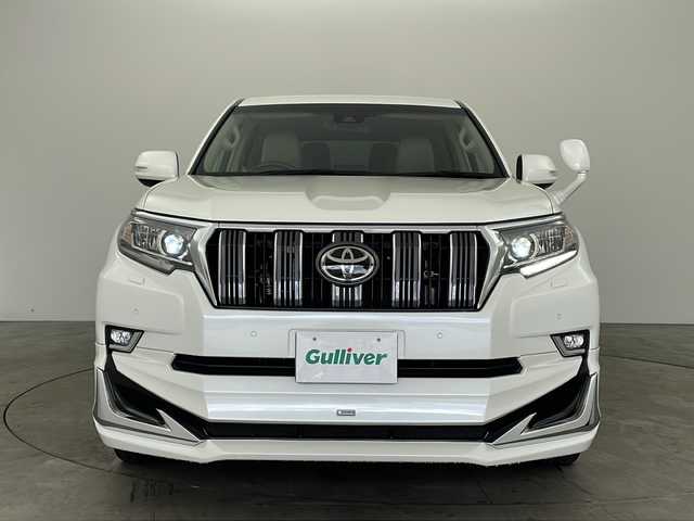 トヨタ ランドクルーザー プラド TX Lパッケージ 兵庫県 2019(平31)年 5万km ホワイトパールクリスタルシャイン ・社外9インチナビ/Bluetooth/CD/DVD/TV/・バックカメラ/・トヨタセーフティセンス/・プリクラッシュセーフティ/・レーンディパーチャーアラート/・オートマチックハイビーム/・レーダークルーズコントロール/・クリアランスソナー/・センターデフロック/・ダウンヒルアシストコントロール/・ローダウン/・オートサイドステップ/・革シート/・前席パワーシート/・前席シートヒーター/・前席ベンチレーション/・モデリスタエアロ/・22インチアルミホイールタイヤ/・LEDヘッドライト/・フォグランプ/・ビルトインETC/・スマートキー