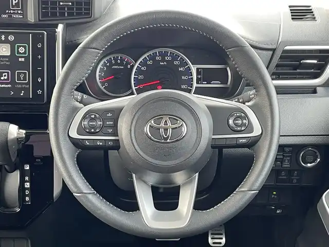 トヨタ ルーミー カスタムG－T 福岡県 2024(令6)年 0.8万km ブラックマイカメタリック モデリスタエアロ/スマートアシスト搭載/レーンキープアシスト/純正9インチディスプレイオーディオ/（BT/USB/FM/AM/AppleCarplay/AndroidAuto）/全周囲カメラ/ビルトインETC２．０/ステアリングスイッチ/ドライブレコーダー前後/社外デジタルインナーミラー/両側パワースライドドア/電動パーキングブレーキ/コーナーセンサー前後/純正フロアマット/純正アルミホイール/LEDライト/プッシュスタート/スマートキー/取扱説明書