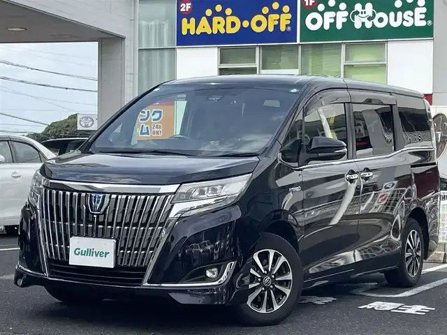 トヨタ エスクァイア ハイブリッド Gi プレミアムパッケージ 長崎県 2017(平29)年 9.1万km スパークリングブラックパールクリスタルシャイン ワンオーナー/純正ナビ　NSZN-Z66T/（フルセグ、CD、DVD、AM、FM、BTオーディオ）/バックカメラ/プッシュスタート/両側パワースライドドア/TRC/トヨタセーフティ―センス/プリクラッシュ/車線逸脱警報/オートハイビーム/ステアリングヒーター/ビルトインETC/クルーズコントロール/電格ウィンカーミラー/COMTEC製ドラレコ/DN席シートヒーター/ハーフレザーシート/オールオートパワーウィンドウ/フリップダウンモニター/純正フロアマット/センターコンソール/純正ドアバイザー/ABS/ダブルエアバッグ/取扱説明書/保証書