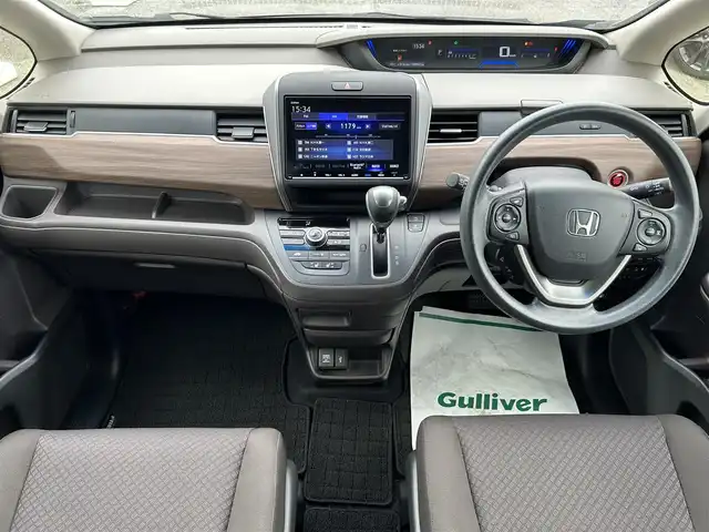 ホンダ フリード G ホンダセンシング 千葉県 2020(令2)年 5万km クリスタルブラックパール ホンダセンシング/・衝突軽減ブレーキ/・レーンキープアシスト/・アダプティブクルーズコントロール/純正9インチSDナビ【VXM-207VFNi】/・CD/DVD/MSV/Bluetooth/フルセグTV/バックカメラ/純正フリップダウンモニター【VM-155N】/両後パワースライドドア/前席シートヒーター/スマートキー/ビルトインETC/コーナーセンサー/純正LEDヘッドライト/木目調パネル