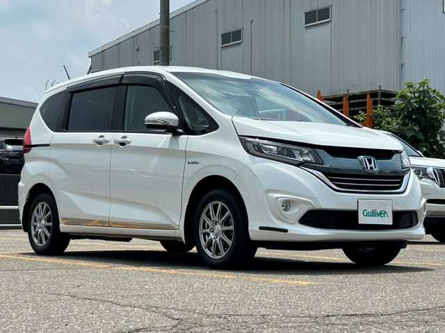 ホンダ フリード ハイブリット G ホンダセンシング 秋田県 2017(平29)年 6.5万km ホワイトオーキッドパール ４WD/両側パワースライドドア/純正ナビ/ETC/横滑り防止装置/衝突被害軽減システム/レーダークルーズコントロール/ECON/LEDライト/フォグランプ/オートライト/前席シートヒーター/社外アルミホイール