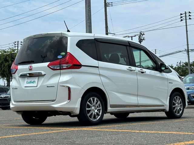 ホンダ フリード ハイブリット G ホンダセンシング 秋田県 2017(平29)年 6.5万km ホワイトオーキッドパール ４WD/両側パワースライドドア/純正ナビ/ETC/横滑り防止装置/衝突被害軽減システム/レーダークルーズコントロール/ECON/LEDライト/フォグランプ/オートライト/前席シートヒーター/社外アルミホイール