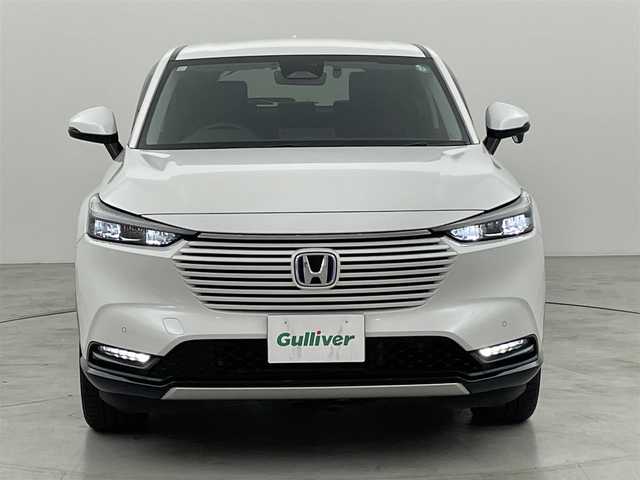 ホンダ ヴェゼル ハイブリッド e:HEV Z 福岡県 2021(令3)年 6.4万km プラチナホワイトパール 純正ナビ（フルセグＴＶ）　/バックカメラ　/ＥＴＣ　/前後ドラレコ　/ＡＣＣ　/コーナーセンサー　/衝突被害軽減ブレーキ　/レーンキープ　/ＢＳＭ　/アクセル踏み間違い防止　/パドルシフト　/パワーバックドア　/ハーフレザー