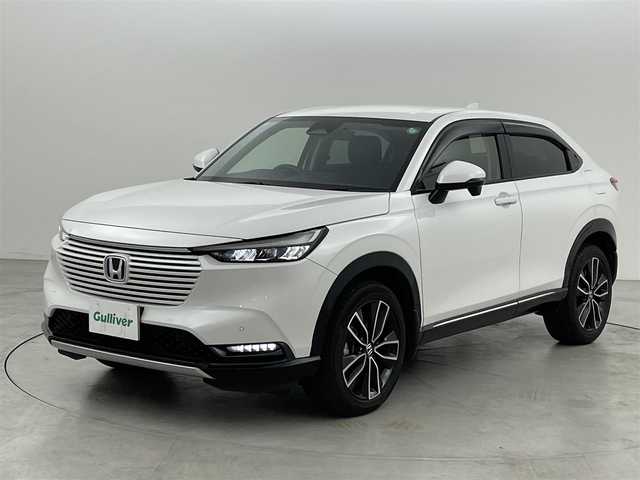 ホンダ ヴェゼル ハイブリッド e:HEV Z 福岡県 2021(令3)年 6.4万km プラチナホワイトパール 純正ナビ（フルセグＴＶ）　/バックカメラ　/ＥＴＣ　/前後ドラレコ　/ＡＣＣ　/コーナーセンサー　/衝突被害軽減ブレーキ　/レーンキープ　/ＢＳＭ　/アクセル踏み間違い防止　/パドルシフト　/パワーバックドア　/ハーフレザー