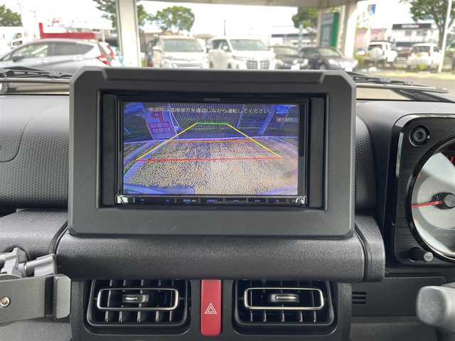 スズキ ジムニー XC 宮城県 2022(令4)年 1.4万km ミディアムグレー /社外メモリナビ//CD/DVD/SD/BT/HDMI/フルセグテレビ//バックカメラ//クルーズコントロール//ETC//社外ドライブレコーダー前後//シートヒーター前席//衝突被害軽減ブレーキ//レーンキープアシスト//ルーフキャリア//背面タイヤカバー（純正背面タイヤ有り）//社外16インチアルミスタッドレスタイヤ積込//スマートキーx2