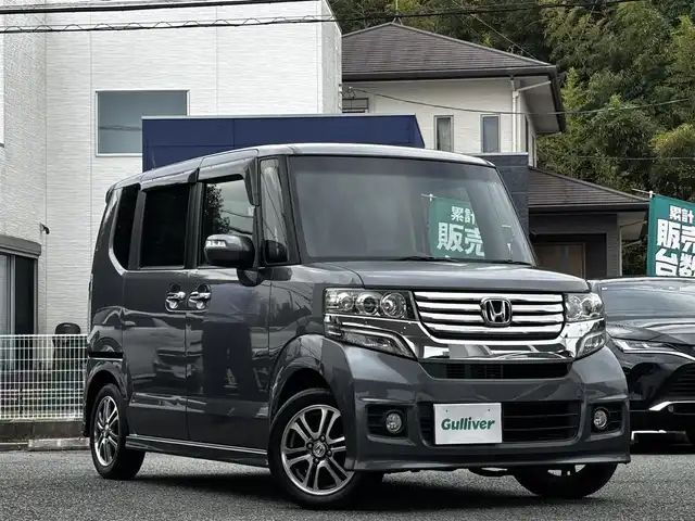 ホンダ Ｎ ＢＯＸ カスタム G Lパッケージ 熊本県 2013(平25)年 13.3万km ポリッシュドメタルメタリック 純正ナビ（VXM-128VS）/【ワンセグTV/CD/DVD】/バックカメラ/片側パワースライドドア/純正14インチAW/アイドリングストップ/横滑り防止/プッシュスタート/スマートキー/スペアキー/ウインカーミラー/純正フロアマット/ドアバイザー/取扱説明書