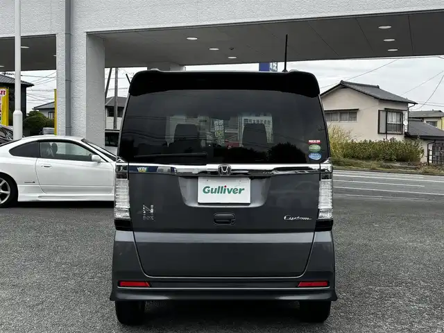 ホンダ Ｎ ＢＯＸ カスタム G Lパッケージ 熊本県 2013(平25)年 13.3万km ポリッシュドメタルメタリック 純正ナビ（VXM-128VS）/【ワンセグTV/CD/DVD】/バックカメラ/片側パワースライドドア/純正14インチAW/アイドリングストップ/横滑り防止/プッシュスタート/スマートキー/スペアキー/ウインカーミラー/純正フロアマット/ドアバイザー/取扱説明書