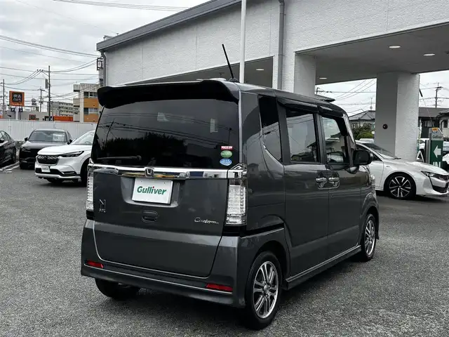 ホンダ Ｎ ＢＯＸ カスタム G Lパッケージ 熊本県 2013(平25)年 13.3万km ポリッシュドメタルメタリック 純正ナビ（VXM-128VS）/【ワンセグTV/CD/DVD】/バックカメラ/片側パワースライドドア/純正14インチAW/アイドリングストップ/横滑り防止/プッシュスタート/スマートキー/スペアキー/ウインカーミラー/純正フロアマット/ドアバイザー/取扱説明書