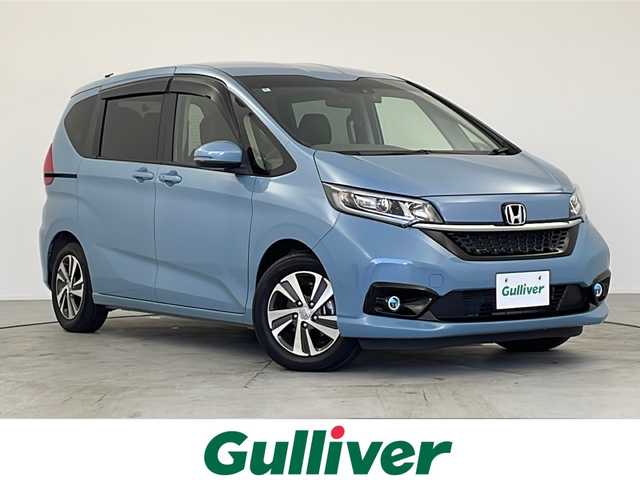 ホンダ フリード G ホンダセンシング 愛知県 2022(令4)年 1.2万km シーグラスブルーパール 純正9インチナビ/【Bluetooth/フルセグTV/Apple Carplay/CD/DVD/AM/FM/USB】/バックカメラ/両側パワースライドドア/衝突軽減ブレーキ/誤発進抑制機能/歩行者事故低減ステアリング/路外逸脱抑制機能/レーダークルーズコントロール/標識認識機能/先行車発進お知らせ機能/コーナーセンサー/アイドリングストップ/D/Nシートヒーター/ハーフレザーシート/前後ドライブレコーダー/ビルトインETC/ステアリングスイッチ/プッシュスタート/スマートキー/革巻きステアリング/ドアバイザー/純正フロアマット/LEDオートライト/フォグランプ/純正15インチアルミホイール/ドアバイザー/電動格納ミラー