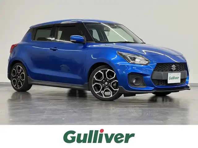 スズキ スイフト スポーツ セーフティPKG 三重県 2018(平30)年 9.6万km スピーディーブルーM ガソリン（ハイオク）ターボ/FF/6F/カロッツェリア 8インチ『サイバーナビ』AVIC-CL901/（FM/AM/MSV/SD/Bluetooth/USB/iPod/HDMI/AUX）/【OP】全方位モニター/ビルトイン ETC/安全/【OP】セーフティパッケージ/・デュアルセンサーブレーキサポート/・車線逸脱抑制機能/・車線逸脱警報機能/・ふらつき警報機能/・アダプティブクルーズコントロール/・標識認識機能（車両進入禁止、はみ出し通行禁止、最高速度）/装備/・TEIN車高調キット FLEX Z/・シートヒーター（D）/・オートエアコン/・オートライトシステム/・LEDヘッドランプ/・オートハイビーム機能/・前後フォグランプ/・プッシュスタート/・ステアリングスイッチ/・純正17inAW/・保/取/・予備スマートキーx1