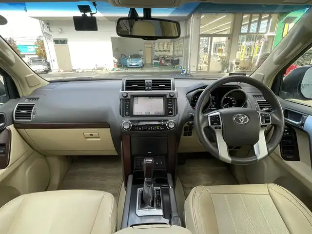 トヨタ ランドクルーザー プラド TX Lパッケージ 宮城県 2015(平27)年 19.7万km ホワイトパールクリスタルシャイン 4WD/純正メモリーナビ/（ＡＭ／ＦＭ／ＣＤ／ＤＶＤ／Ｂｌｕｅｔｏｏｔｈ）　/サンルーフ　/モデリスタエアロ　/ベージュレザーシート　/ルーフレール/クルーズコントロール　/センターデフロック　/コーナーセンサー　/横滑り防止装置/ダウンヒルアシストコントロール/フロントワイパーデアイサー/ヘッドライトウォッシャー/前席シートヒーター/前席パワーシート/バックカメラ/フロントカメラ/サイドカメラ/スマートキー/プッシュスタート/ETC/ドラレコ/牽引/純正バグガード