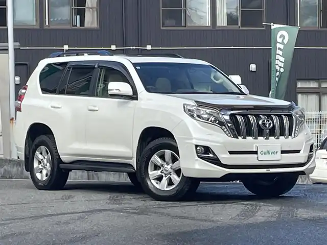 トヨタ ランドクルーザー プラド TX Lパッケージ 宮城県 2015(平27)年 19.7万km ホワイトパールクリスタルシャイン 4WD/純正メモリーナビ/（ＡＭ／ＦＭ／ＣＤ／ＤＶＤ／Ｂｌｕｅｔｏｏｔｈ）　/サンルーフ　/モデリスタエアロ　/ベージュレザーシート　/ルーフレール/クルーズコントロール　/センターデフロック　/コーナーセンサー　/横滑り防止装置/ダウンヒルアシストコントロール/フロントワイパーデアイサー/ヘッドライトウォッシャー/前席シートヒーター/前席パワーシート/バックカメラ/フロントカメラ/サイドカメラ/スマートキー/プッシュスタート/ETC/ドラレコ/牽引/純正バグガード