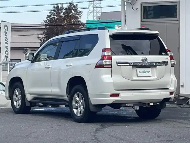 トヨタ ランドクルーザー プラド TX Lパッケージ 宮城県 2015(平27)年 19.7万km ホワイトパールクリスタルシャイン 4WD/純正メモリーナビ/（ＡＭ／ＦＭ／ＣＤ／ＤＶＤ／Ｂｌｕｅｔｏｏｔｈ）　/サンルーフ　/モデリスタエアロ　/ベージュレザーシート　/ルーフレール/クルーズコントロール　/センターデフロック　/コーナーセンサー　/横滑り防止装置/ダウンヒルアシストコントロール/フロントワイパーデアイサー/ヘッドライトウォッシャー/前席シートヒーター/前席パワーシート/バックカメラ/フロントカメラ/サイドカメラ/スマートキー/プッシュスタート/ETC/ドラレコ/牽引/純正バグガード