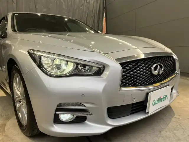 日産 スカイライン ハイブリッド 350GT Type P 東京都 2015(平27)年 3.1万km ブリリアントシルバー ワンオーナー/黒レザーシート/前席パワーシート/前席シートヒーター/純正SDナビ/CD/DVD/BT/USB/AUX/アラウンドビューモニター/インテリジェントクルーズコントロール/エマージェンシーブレーキ/車線逸脱警報(LDW)/車線逸脱防止支援システム(LDP)/後側方車両検知警報(BSW)/後側方衝突防止支援システム(BSI)/インテリジェントペダル/クリアランスソナー/純正17インチアルミホイール/アイドリングストップ/ビルトインETC/LEDライト＆フォグ/スマートキー