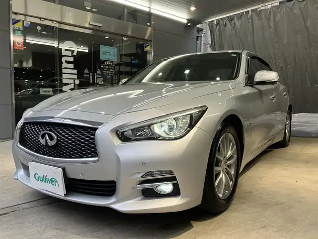 日産 スカイライン ハイブリッド 350GT Type P 東京都 2015(平27)年 3.1万km ブリリアントシルバー ワンオーナー/黒レザーシート/前席パワーシート/前席シートヒーター/純正SDナビ/CD/DVD/BT/USB/AUX/アラウンドビューモニター/インテリジェントクルーズコントロール/エマージェンシーブレーキ/車線逸脱警報(LDW)/車線逸脱防止支援システム(LDP)/後側方車両検知警報(BSW)/後側方衝突防止支援システム(BSI)/インテリジェントペダル/クリアランスソナー/純正17インチアルミホイール/アイドリングストップ/ビルトインETC/LEDライト＆フォグ/スマートキー