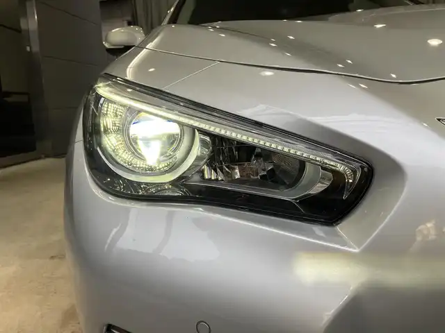 日産 スカイライン ハイブリッド 350GT Type P 東京都 2015(平27)年 3.1万km ブリリアントシルバー ワンオーナー/黒レザーシート/前席パワーシート/前席シートヒーター/純正SDナビ/CD/DVD/BT/USB/AUX/アラウンドビューモニター/インテリジェントクルーズコントロール/エマージェンシーブレーキ/車線逸脱警報(LDW)/車線逸脱防止支援システム(LDP)/後側方車両検知警報(BSW)/後側方衝突防止支援システム(BSI)/インテリジェントペダル/クリアランスソナー/純正17インチアルミホイール/アイドリングストップ/ビルトインETC/LEDライト＆フォグ/スマートキー