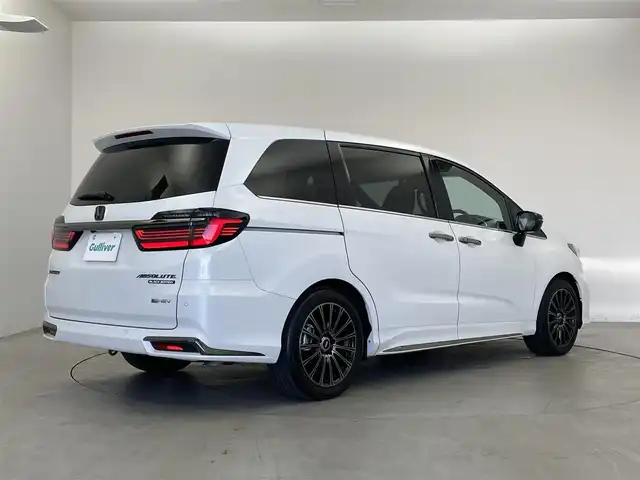 ホンダ オデッセイ ハイブリッド e:HEVアブソルート EXブラックED 埼玉県 2025(令7)年 0.5万km プラチナホワイトパール ホンダセンシング/純正11.4インチHondaCONNECTナビ/ フルセグ CD DVD Bluetooth AppleCarPlay/マルチビューカメラシステム/純正15.6インチリア席モニター/CMBS（衝突軽減ブレーキシステム）/前後誤発進抑制機能/路外逸脱抑制機能/LKAS（車線維持支援システム）/ACC（アダプティブクルーズコントロール）/オートハイビーム/パーキングセンサーシステム/後退出庫サポート/ブラインドスポットインフォメーション/純正11.4インチHondaCONNECTナビ/ フルセグ CD DVD Bluetooth AppleCarPlay/マルチビューカメラシステム/純正15.6インチリア席モニター/ワイヤレス充電器/本革シート/前席パワーシート/前席2列目シートヒーター/ハンズフリーアクセスパワーテールゲート/両側パワースライドドア/本革巻きステアリング/ステアリングリモコン/パドルシフト/電子パーキングブレーキ/オートブレーキホールド/LEDオートライト/純正無限18インチアルミ/純正無限フロアマット/ビルトインETC2.0/前後ドラレコ