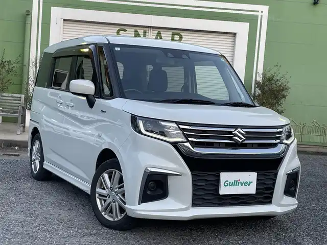 スズキ ソリオ HV MX 埼玉県 2020(令2)年 1.3万km ピュアホワイトP 衝突軽減ブレーキ/レーダークルーズコントロール/前席シートヒーター/LEDヘッドライト/クリアランスソナー/純正15インチアルミ/左パワースライドドア/プッシュスタート/スマートキー/走行１２９３３キロ/保証書付整備手帳/取扱説明書