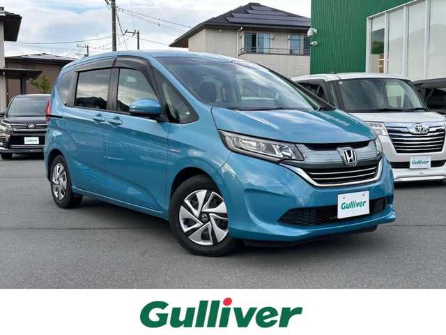 ホンダ フリード＋ ハイブリット G ホンダセンシング 静岡県 2018(平30)年 4.5万km ブルーホライゾンM エンジンスタートボタン/パワーステアリング/パワーウィンドウ/寒冷地仕様/アイドリングストップ/スマートキー/AAC/クルーズコントロール（追従走行：有）/純正ビルトインETC/バックカメラ/純正メモリナビ（BT接続、ワンセグTV、DVD再生機能、CDチェンジャー）/ウォークスルー/布系シート/純正フロアマット/両側パワースライドドア/ABS/横滑り防止装置/レーンキープアシスト/オートライト/キセノンヘッドライト/Wエアバック/衝突軽減システム