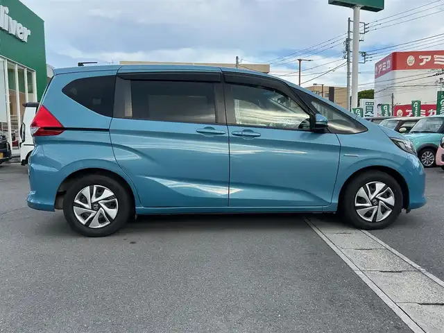 ホンダ フリード＋ ハイブリット G ホンダセンシング 静岡県 2018(平30)年 4.5万km ブルーホライゾンM エンジンスタートボタン/パワーステアリング/パワーウィンドウ/寒冷地仕様/アイドリングストップ/スマートキー/AAC/クルーズコントロール（追従走行：有）/純正ビルトインETC/バックカメラ/純正メモリナビ（BT接続、ワンセグTV、DVD再生機能、CDチェンジャー）/ウォークスルー/布系シート/純正フロアマット/両側パワースライドドア/ABS/横滑り防止装置/レーンキープアシスト/オートライト/キセノンヘッドライト/Wエアバック/衝突軽減システム
