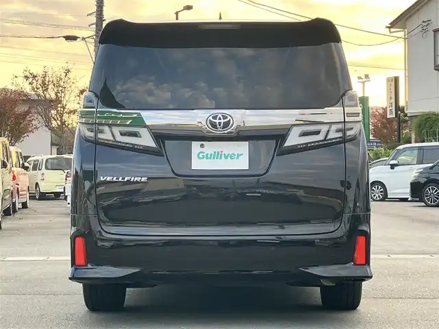 トヨタ ヴェルファイア Z Gエディション 静岡県 2021(令3)年 1.1万km ブラック 純正9インチナビ（CD/DVD/BT）/バックカメラ/エンジンスタートボタン/パワーステアリング/パワーウィンドウ/保証書/取扱説明書/スマートキー/Wオートエアコン/レーダークルーズコントロール/12.1インチ後席モニター/USB入力端子/ETC/三列シート/N席電動オットマン/電動リアゲート/ドライブレコーダー前後/フロアマット/D席N席パワーシート/合皮シート/D席N席シートヒーター/D席N席エアシート/両側パワースライドドア/純正アルミホイール/ABS/横滑り防止装置/コーナーセンサー前後/レーンキープアシスト/盗難防止装置/オートライト/オートマチックハイビーム/三眼LEDヘッドライト/W+サイドエアバッグ/カーテンエアバッグ/衝突軽減システム/ステアリングヒーター/二列目電動リクライニング/二列目電動オットマン/三列目ヘッドレスト１つ不足