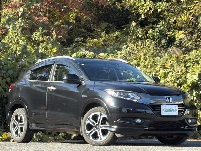 ホンダ ヴェゼル ハイブリッド Z 大分県 2015(平27)年 10.3万km クリスタルブラックパール ワンオーナー /あんしんパッケージ/ハーフレザーシート/シートヒーター/社外メモリーナビ/バックカメラ/フルセグ /DVD/Bluetooth/前後ドライブレコーダー/クルーズコントロール/純正17インチアルミホイール/スマートキー/エンジンプッシュスタート/純正LEDヘッドライト/オートライトコントロール/パドルシフト