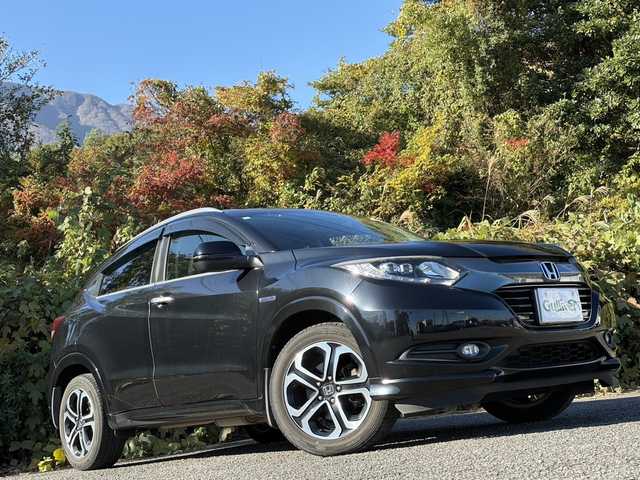 ホンダ ヴェゼル ハイブリッド Z 大分県 2015(平27)年 10.3万km クリスタルブラックパール ワンオーナー /あんしんパッケージ/ハーフレザーシート/シートヒーター/社外メモリーナビ/バックカメラ/フルセグ /DVD/Bluetooth/前後ドライブレコーダー/クルーズコントロール/純正17インチアルミホイール/スマートキー/エンジンプッシュスタート/純正LEDヘッドライト/オートライトコントロール/パドルシフト