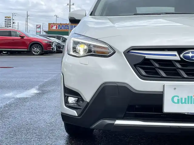 スバル ＸＶ ハイブリッド アドバンス 青森県 2021(令3)年 2.4万km クリスタルホワイトP 4WD/ディーラーオプションナビ/フルセグTV/CD/DVD/BT/ETC2.0/純正ドライブレコーダー/D/N席パワーシート/D席シートメモリ/ハーフレザーシート/本革巻きステアリング/電動パーキングブレーキ/LEDオートライト/フォグランプ/ステアリング連動ヘッドランプ/アイサイトVer3.0/社外17インチホイール付きスタッドレスタイヤ積込