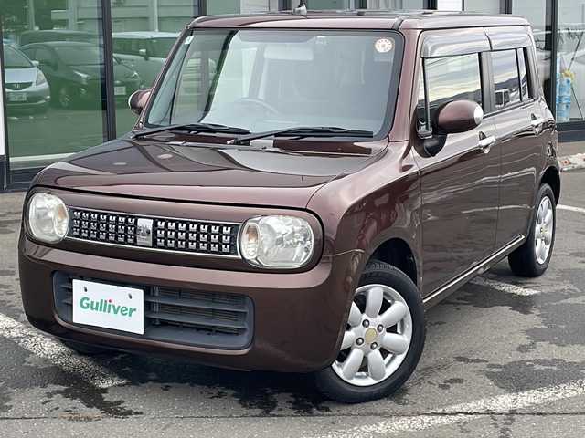 スズキ ラパン 10thアニバーサリーリミテッド 道東・釧路十勝 2012(平24)年 10.1万km マルーンブラウンパール ・4WD/・純正CDオーディオ/(CD・FM・AM・ラジオ】/・運転席シートヒーター/・純正フロアマット/・ドアバイザー/・スマートキー/・プッシュスタート/・純正14インチアルミホイール