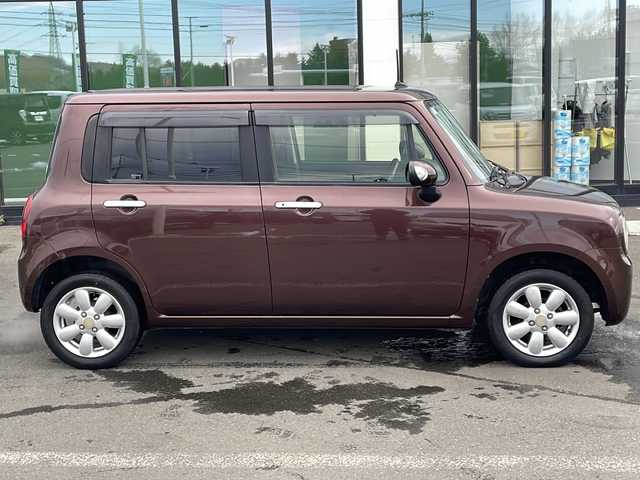 スズキ ラパン 10thアニバーサリーリミテッド 道東・釧路十勝 2012(平24)年 10.1万km マルーンブラウンパール ・4WD/・純正CDオーディオ/(CD・FM・AM・ラジオ】/・運転席シートヒーター/・純正フロアマット/・ドアバイザー/・スマートキー/・プッシュスタート/・純正14インチアルミホイール